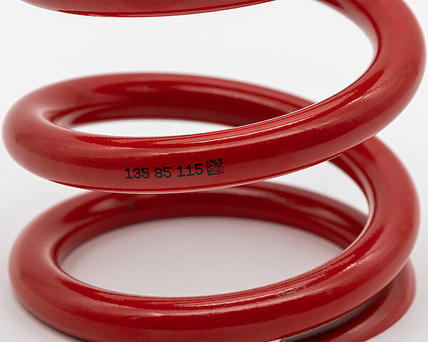 Feder mit Beschriftung durch  CIJ-Drucker